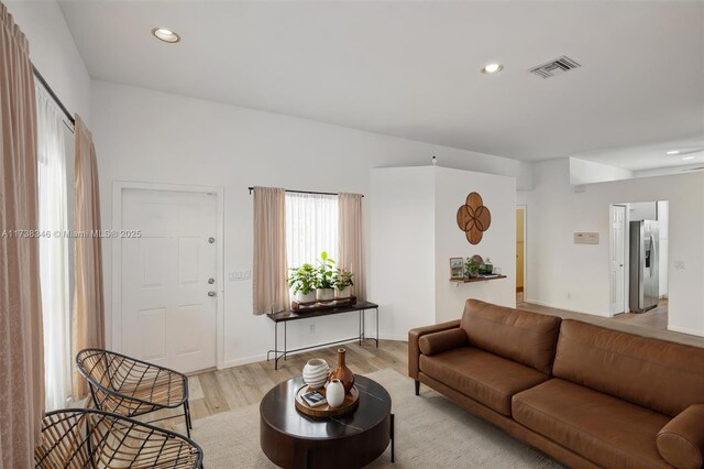 living room with light hardwood / wood-style flooring