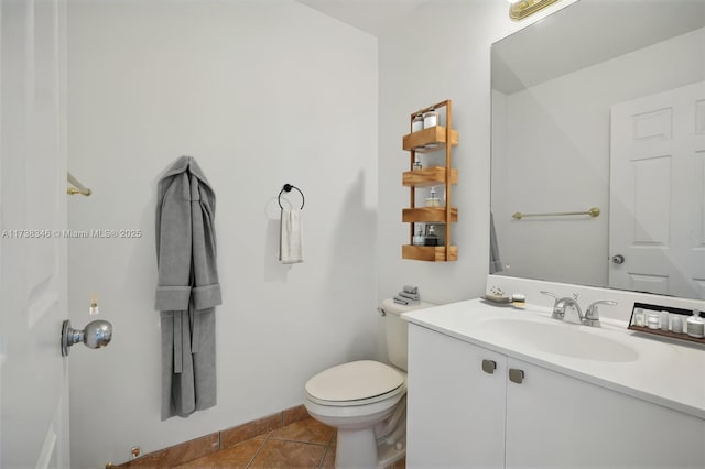 bathroom featuring tile patterned floors, toilet, and vanity