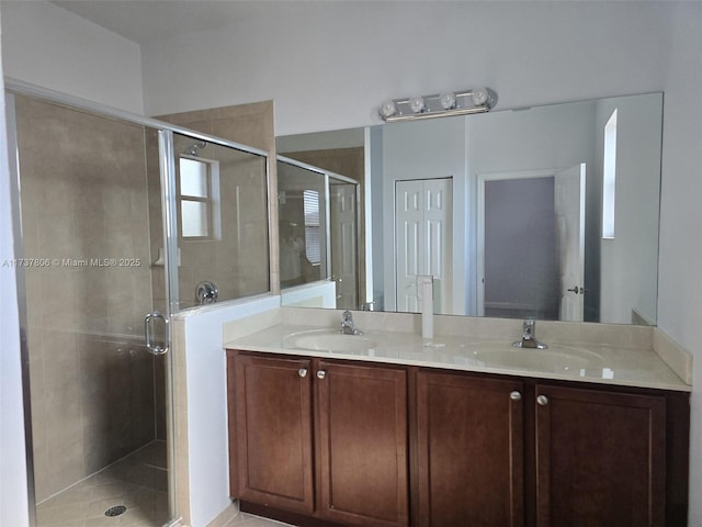 bathroom with walk in shower and vanity