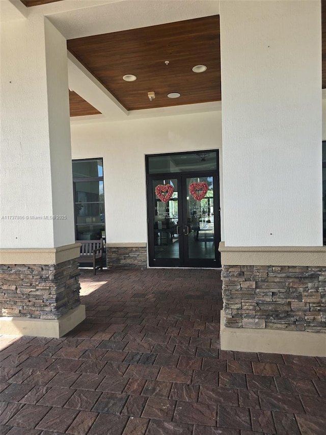 doorway to property featuring french doors