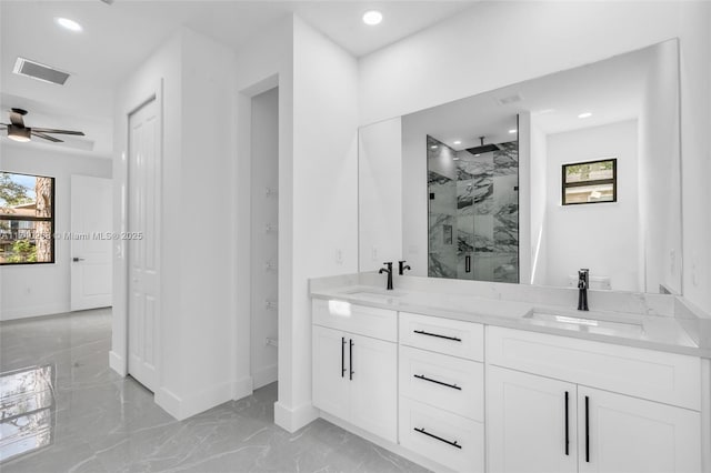 bathroom with ceiling fan, vanity, and an enclosed shower