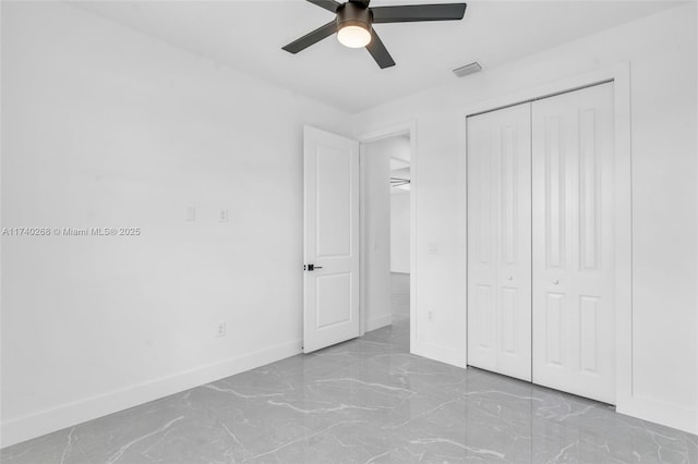 unfurnished bedroom with a closet and ceiling fan