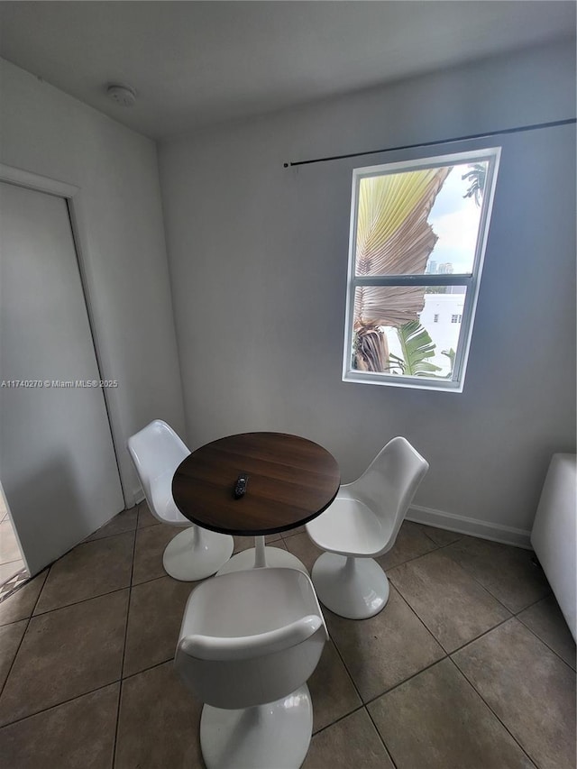 bathroom with tile patterned flooring and toilet