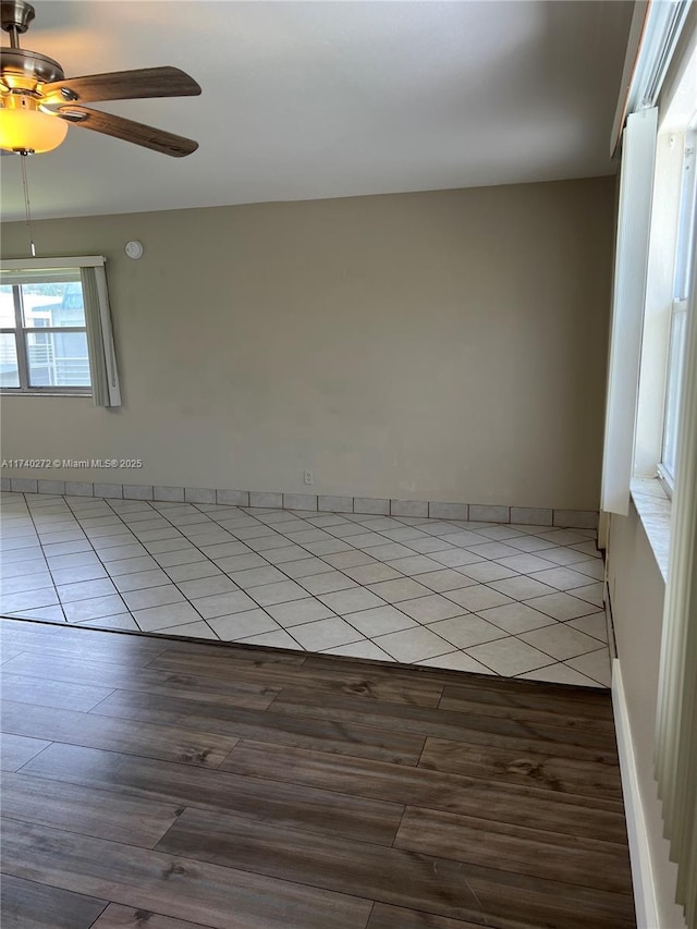 unfurnished room featuring ceiling fan and light wood-type flooring