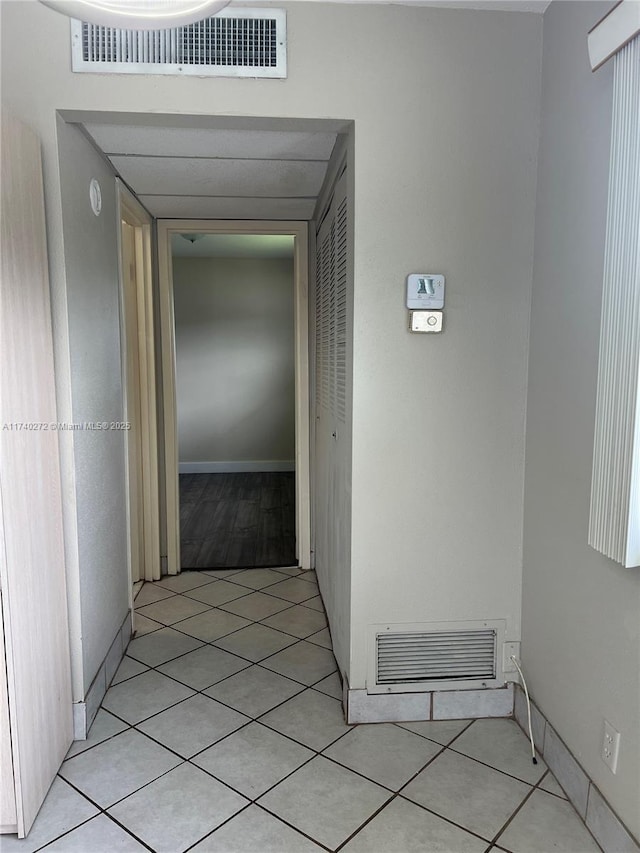 corridor featuring light tile patterned flooring