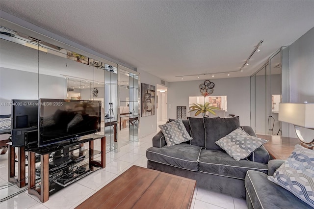 tiled living room with a textured ceiling