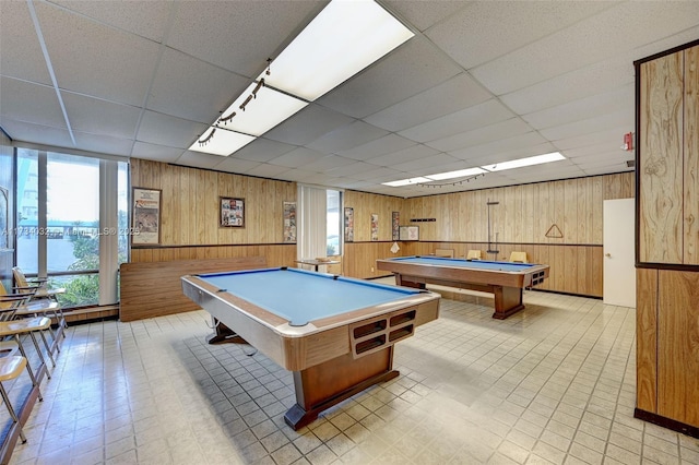 playroom with a drop ceiling, wooden walls, and billiards