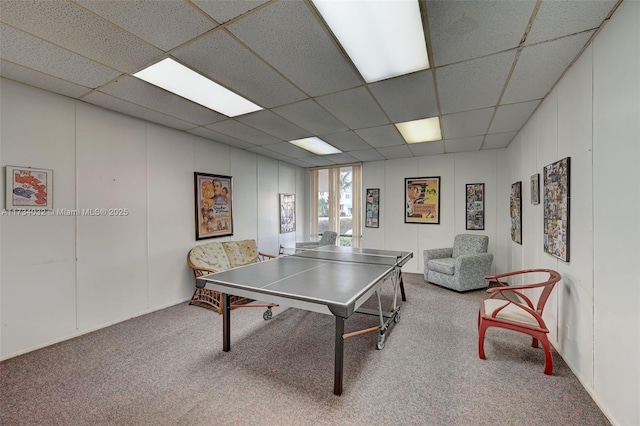 playroom featuring a paneled ceiling and carpet