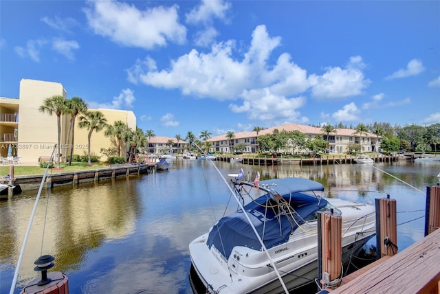 dock area featuring a residential view and a water view