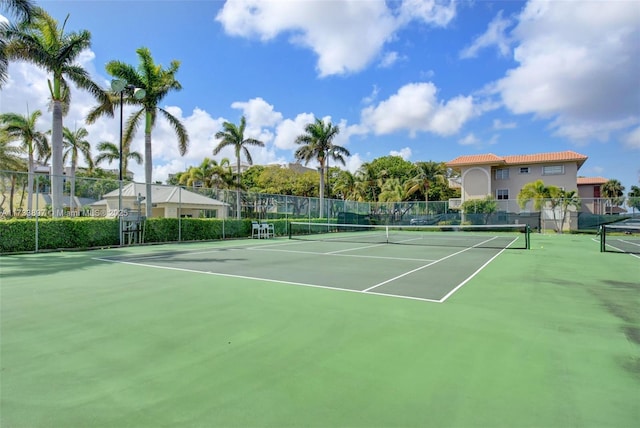 view of sport court with fence