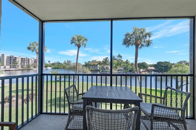 sunroom with a water view and plenty of natural light