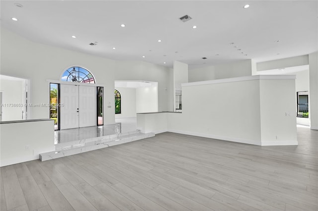 unfurnished living room featuring light wood-type flooring