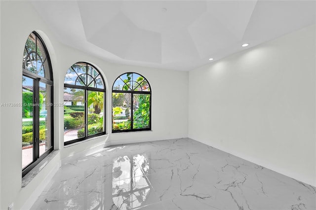 empty room with a tray ceiling