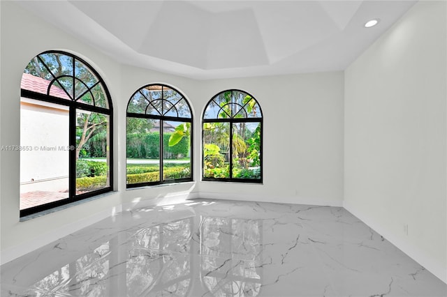 empty room with a tray ceiling