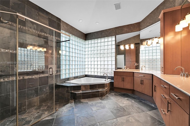 bathroom with vanity, plus walk in shower, and tile walls