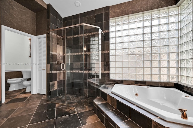 bathroom with a bidet, shower with separate bathtub, and toilet