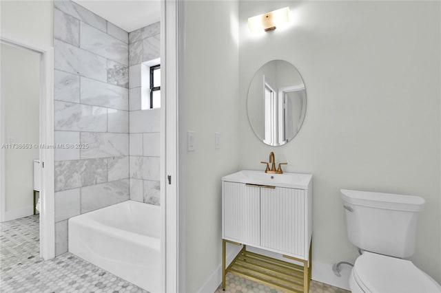 full bathroom with vanity, tiled shower / bath, and toilet