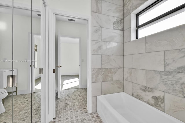 bathroom featuring a tub