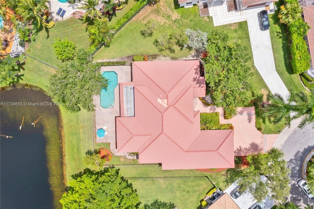 birds eye view of property with a water view