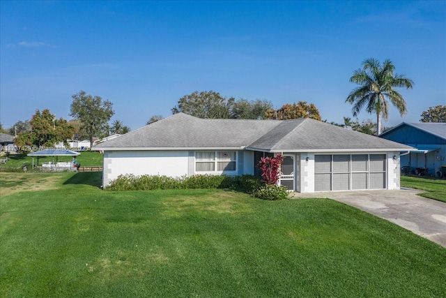 ranch-style home with a garage and a front yard