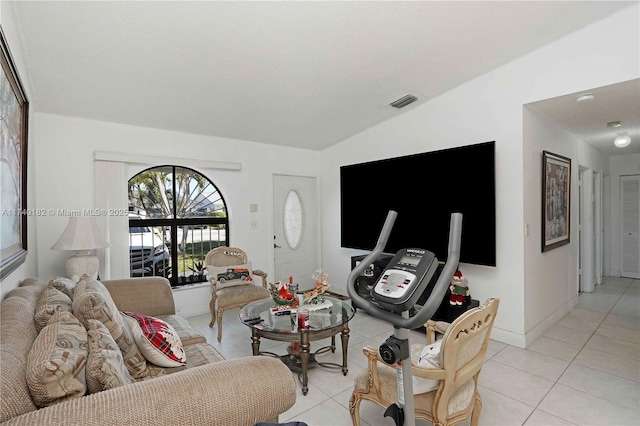 living room featuring a textured ceiling and light tile patterned flooring