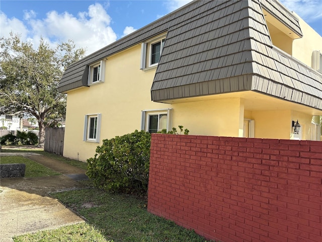 8317 SW 137th Ave Unit 8317, Miami, FL 33183 - view of side of property featuring stucco siding and mansard roof