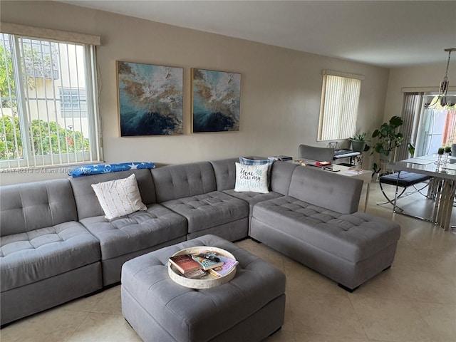 8317 SW 137th Ave Unit 8317, Miami, FL 33183 - living room featuring healthy amount of natural light, light tile patterned flooring, and a chandelier