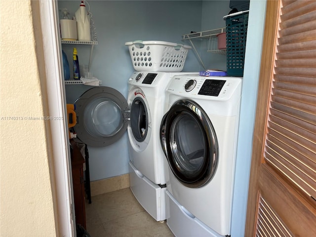 8317 SW 137th Ave Unit 8317, Miami, FL 33183 - laundry area with washing machine and clothes dryer and tile patterned floors