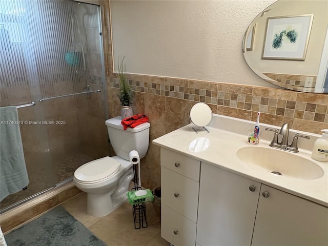 8317 SW 137th Ave Unit 8317, Miami, FL 33183 - full bath with tile walls, vanity, a stall shower, a wainscoted wall, and tile patterned floors