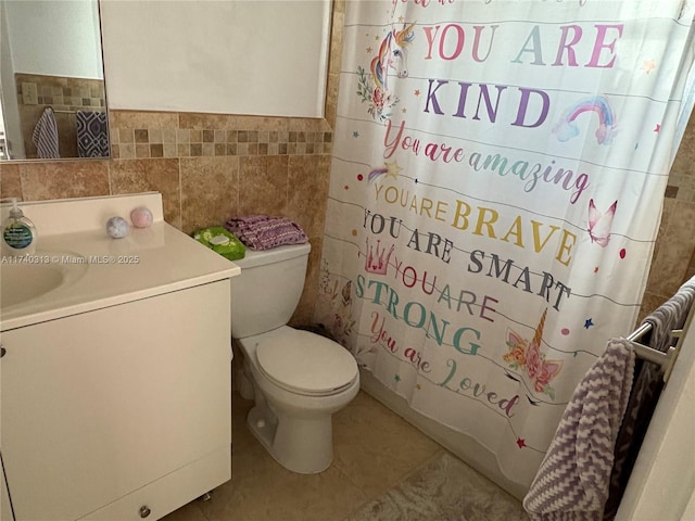 8317 SW 137th Ave Unit 8317, Miami, FL 33183 - bathroom with tile walls, tile patterned flooring, vanity, a wainscoted wall, and shower / tub combo