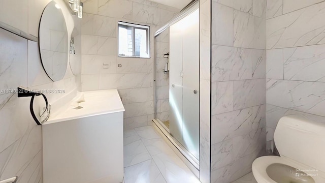 bathroom featuring vanity, toilet, an enclosed shower, and tile walls