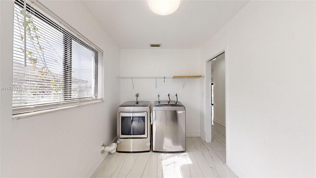 washroom featuring washer and dryer