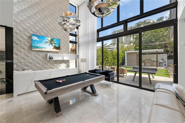 1823 SW 2nd Ct, Miami, FL 33129 - playroom featuring a towering ceiling, tile patterned floors, a wall of windows, and billiards table