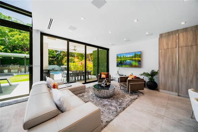 living room featuring a wall of windows