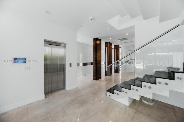 hall featuring baseboards, stairway, visible vents, and elevator