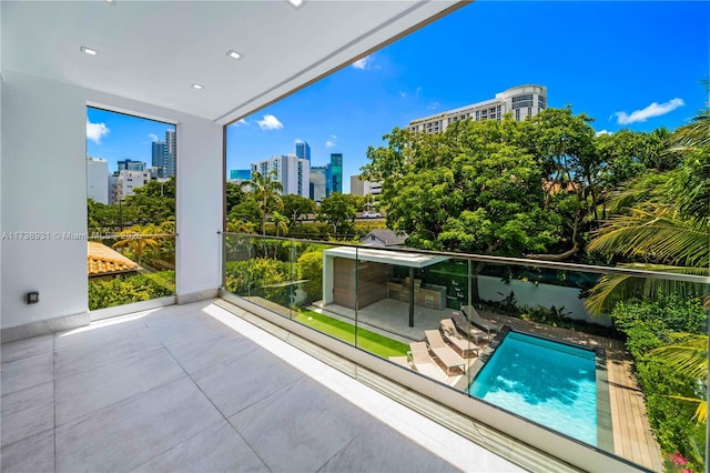 view of swimming pool with a city view