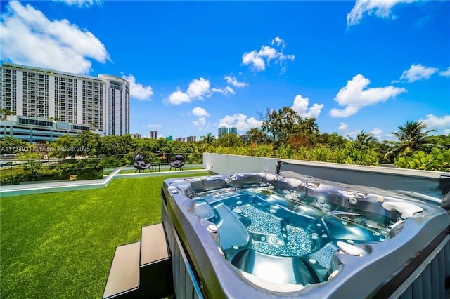 1823 SW 2nd Ct, Miami, FL 33129 - view of pool featuring a hot tub, a lawn, and a view of city