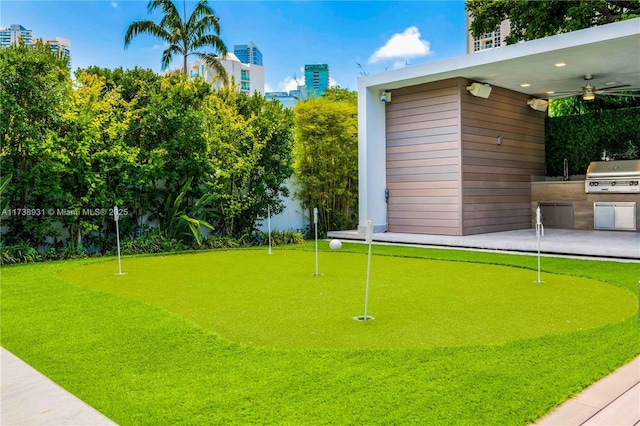 1823 SW 2nd Ct, Miami, FL 33129 - view of home's community with exterior kitchen, an area to practice putting, and a patio