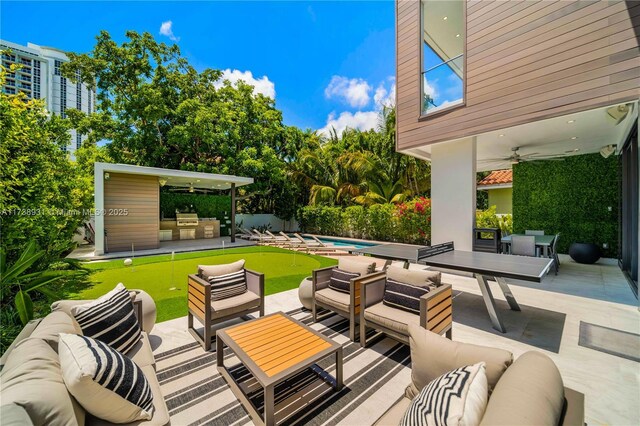 view of pool featuring ceiling fan, an outdoor hangout area, and a patio