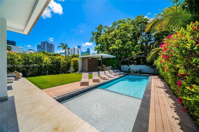1823 SW 2nd Ct, Miami, FL 33129 - view of swimming pool featuring a patio, a putting green, a view of city, and a fenced backyard