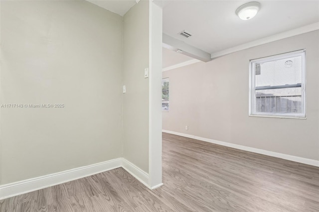 spare room with light hardwood / wood-style floors