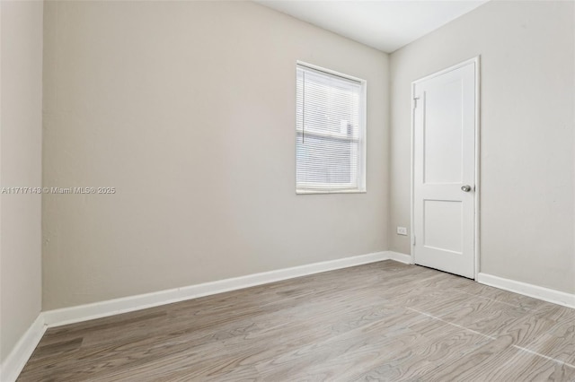 spare room with light wood-type flooring