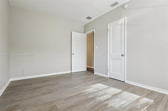 empty room featuring light hardwood / wood-style floors