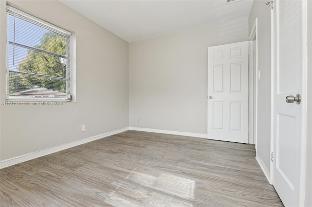 empty room with light wood-type flooring