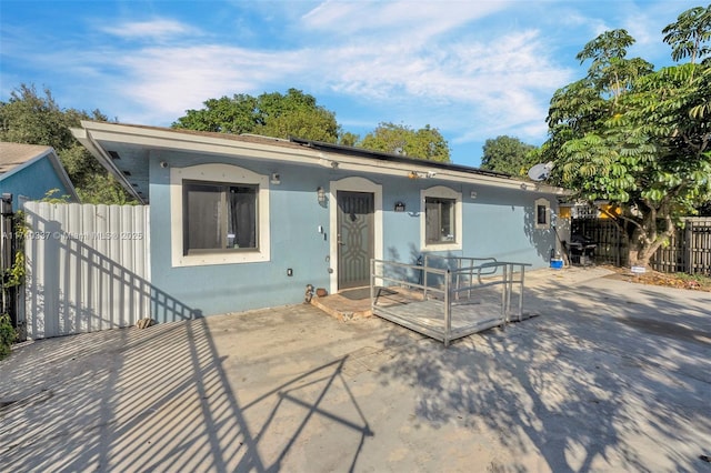 view of front of home featuring a patio