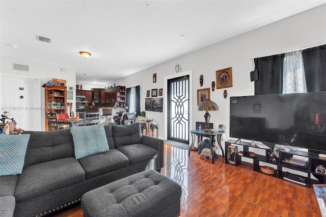 living room with dark hardwood / wood-style flooring