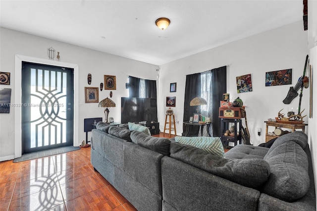 living room with wood-type flooring and a wealth of natural light