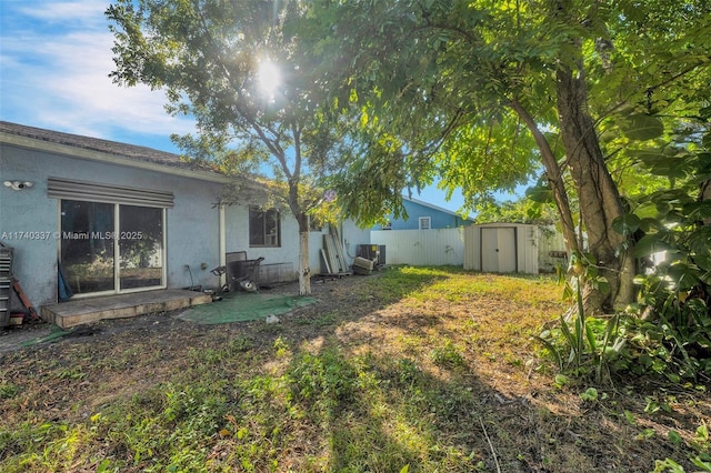 view of yard with a storage shed