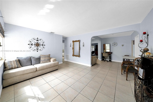 living room with light tile patterned flooring