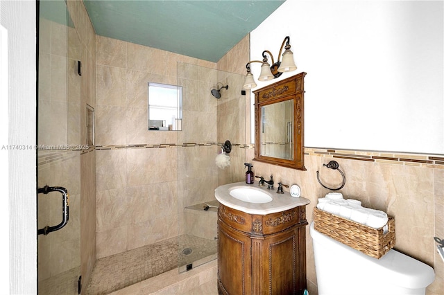 bathroom with vanity, tile walls, and a shower with shower door